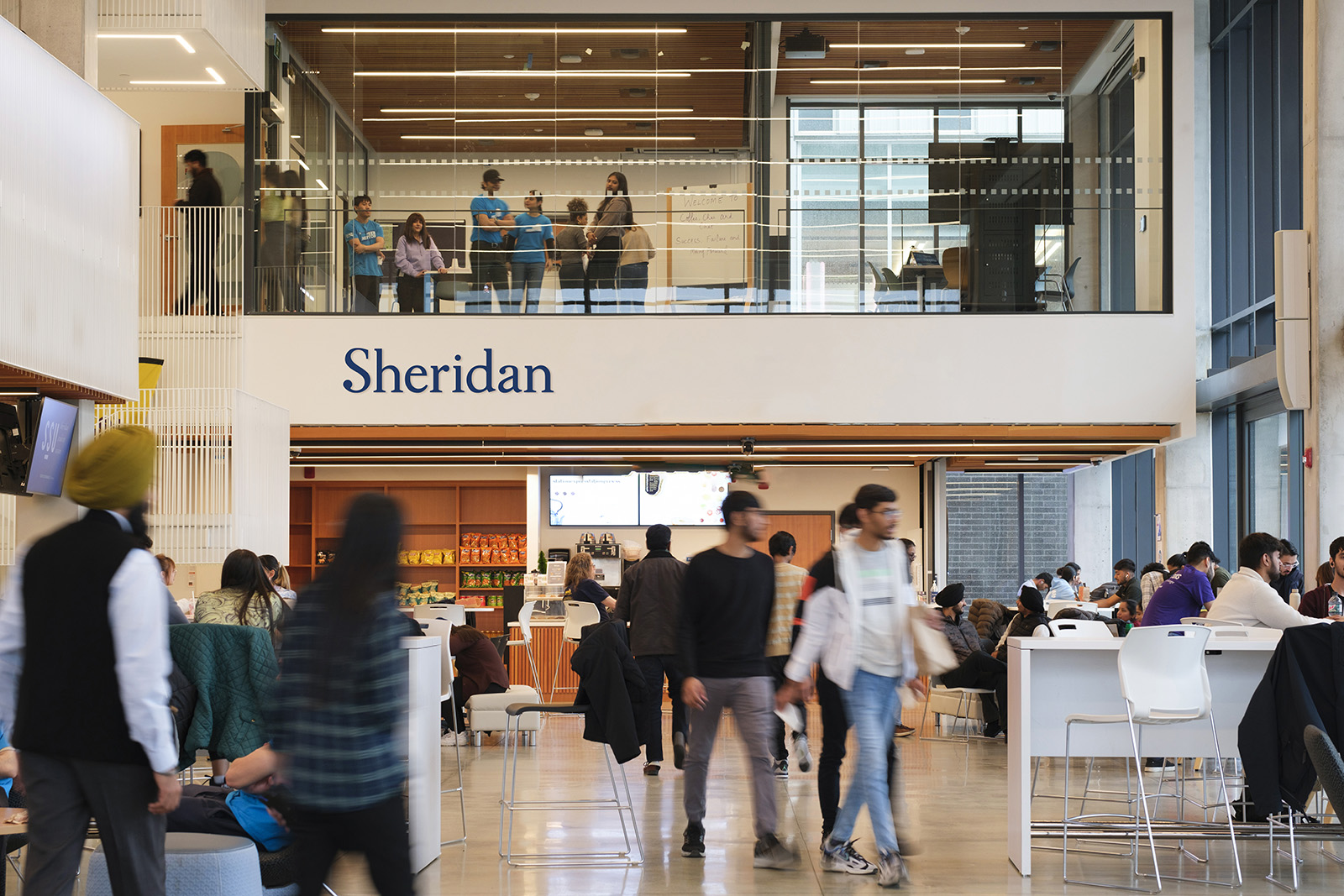 Students walking at Sheridan's HMC Campus