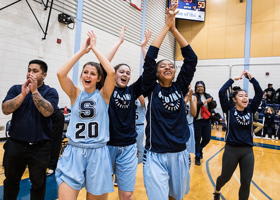 Sheridan Bruins Women's Basketball team celebrate