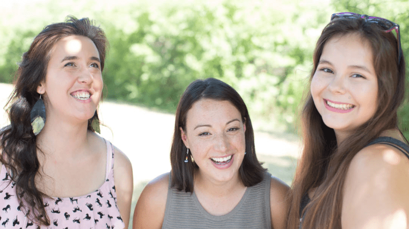 Three girls smiling