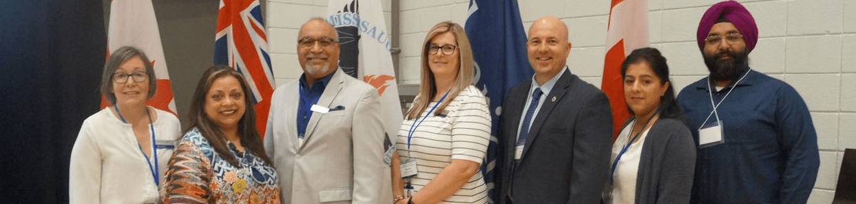Sheridan VP, External Relations Christine Szustaczek stands beside organizers of Sheridan's Improving the international Student Experience Summit