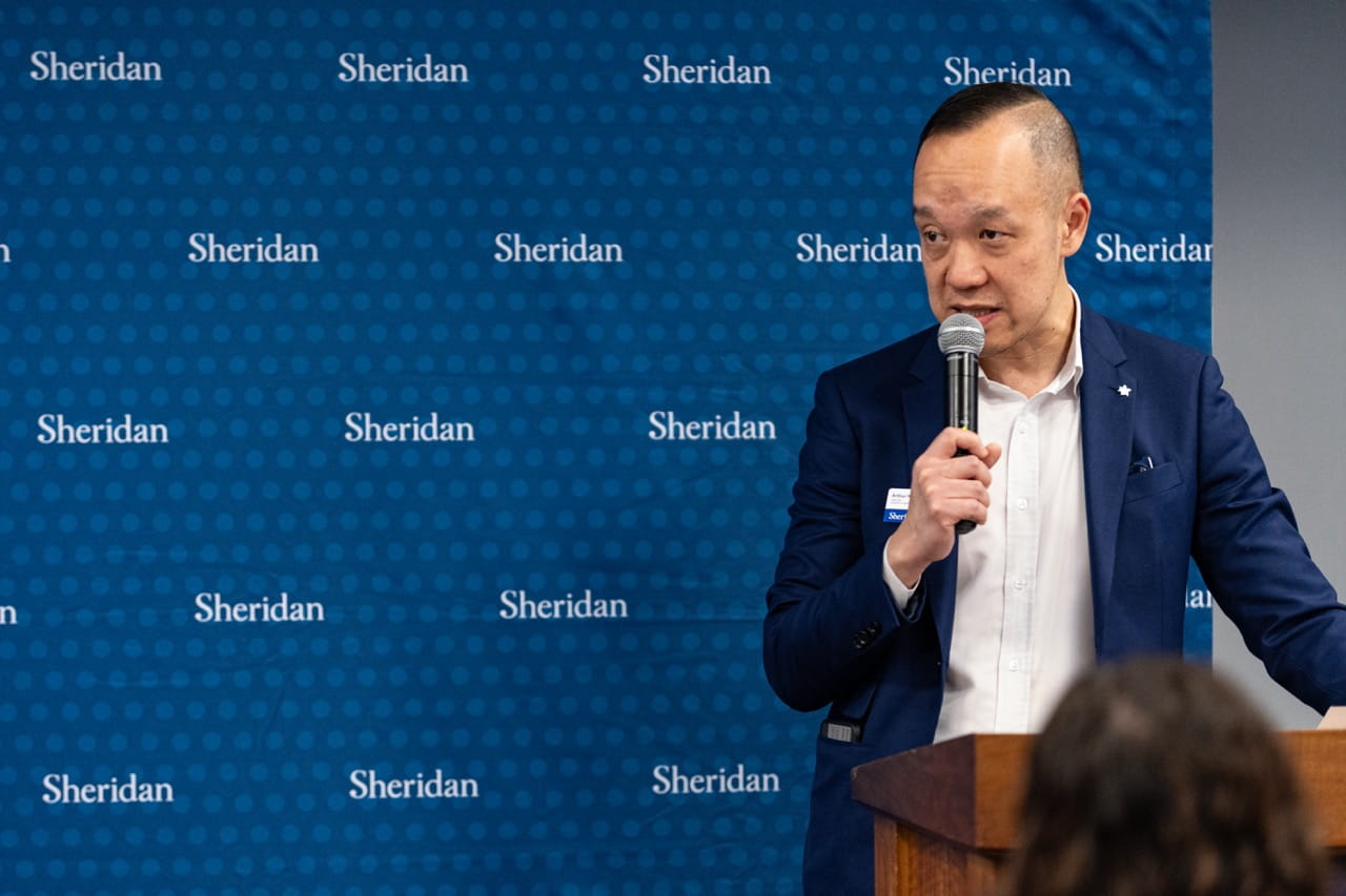 Sheridan Director, Industry and Professional Engagement Arthur Kong speaks at the podium