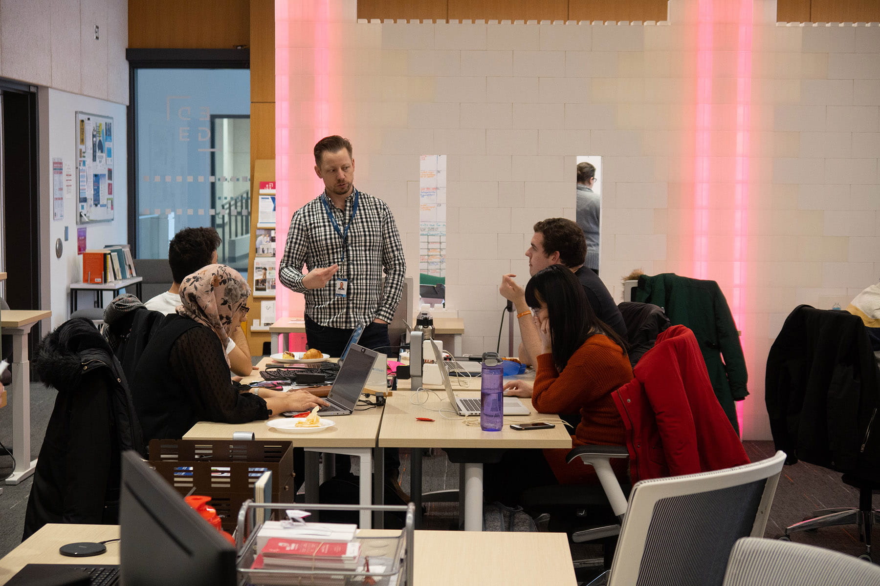 EDGE mentor speaking with students at the hub for entrepreneurship