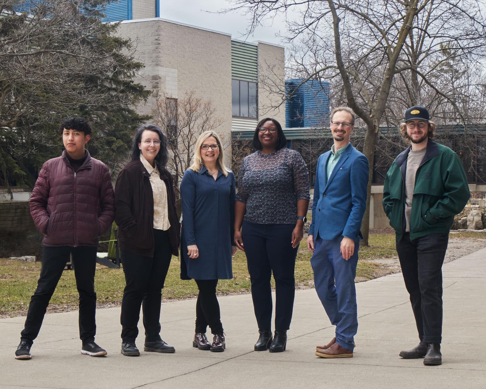 Members of the Everybody's Got A Story project team stand together.