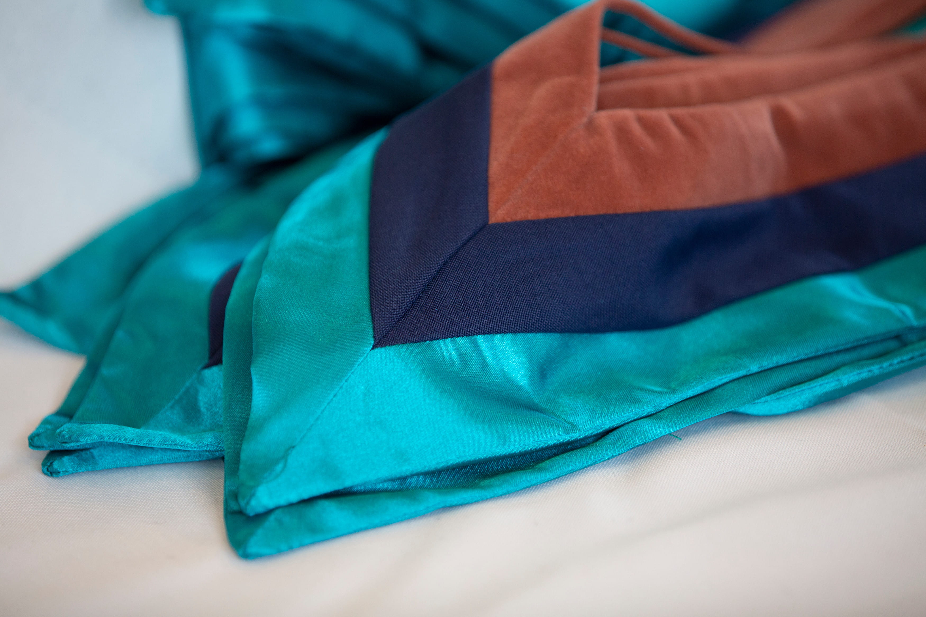 Sheridan light blue, dark blue and orange graduation stole