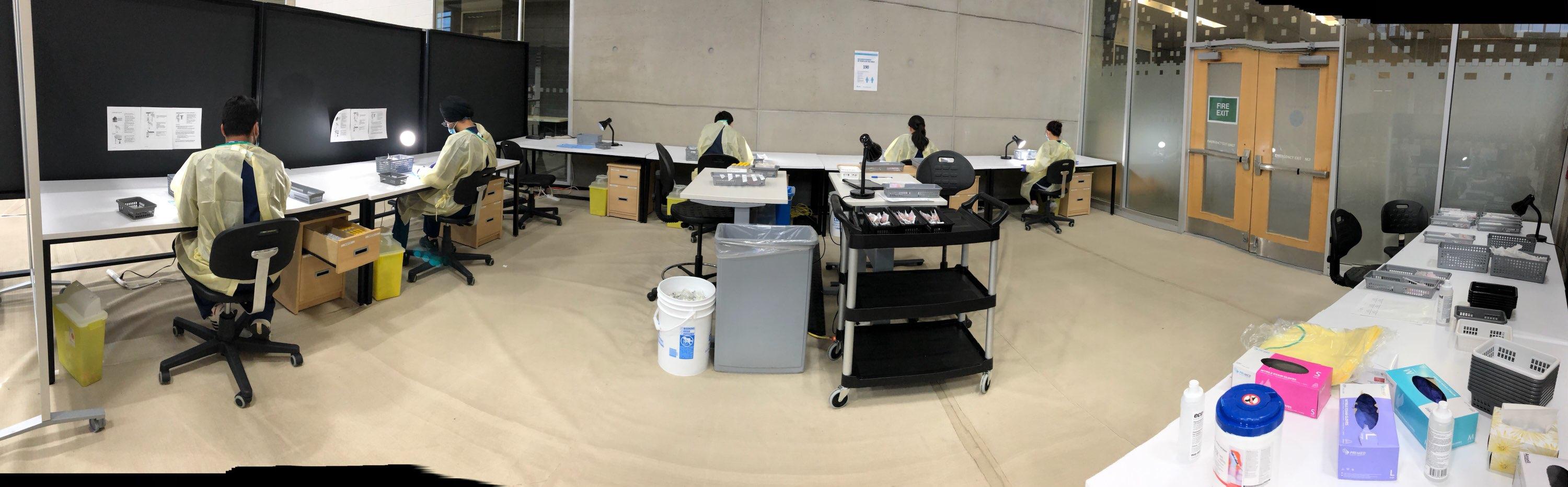 Sheridan students reconstituting vaccines at Trillium Health Partners