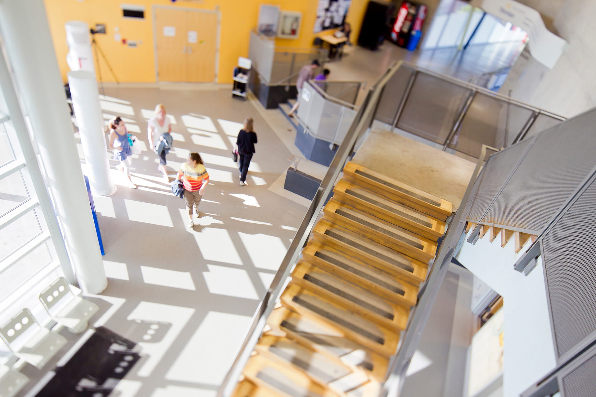 Trafalgar Campus overhead hallway shot of staircase and people below