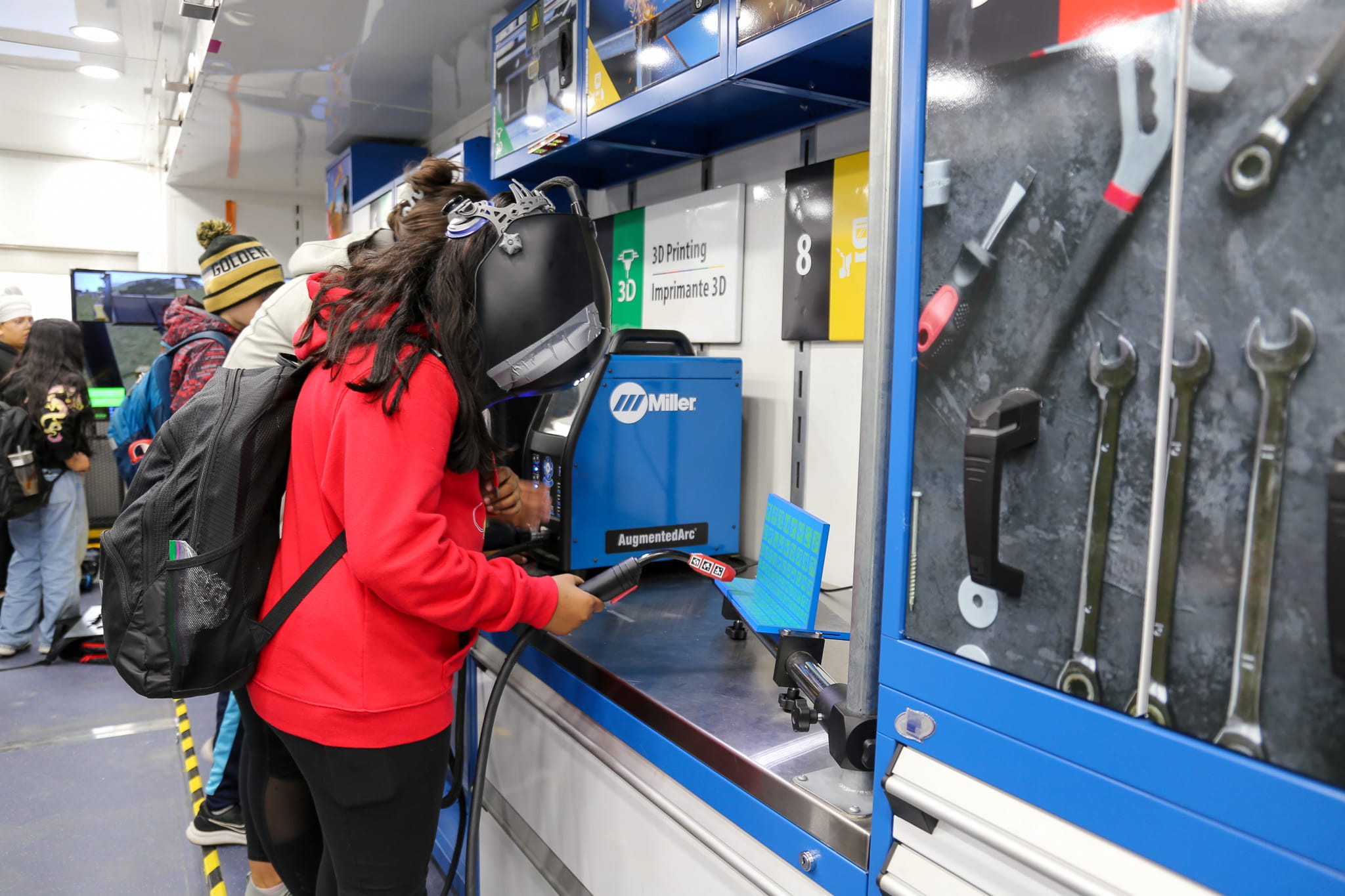 A student from Brampton's Fletcher's Creek Senior Public School simulates a welding activity in the Skills Ontario Trades & Tech Truck.