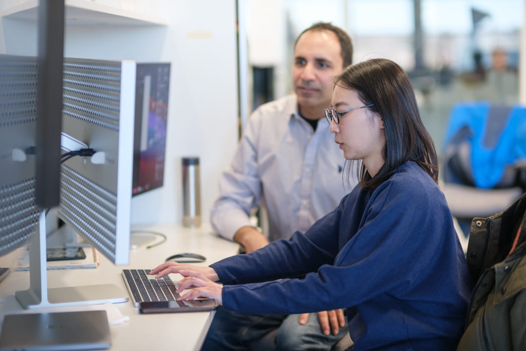 A CAAI student researcher and Dr. Tarek El Salti, researcher and Professor in the Faculty of Applied Science and Technology, working together in the Centre for Applied AI at Trafalgar Road Campus