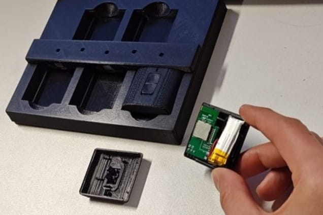 Hand holding a small computer chip